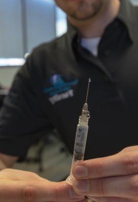 EMS student prepares a syringe